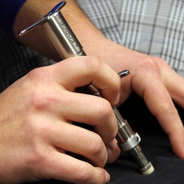 Person using a torque wrench on fabric.