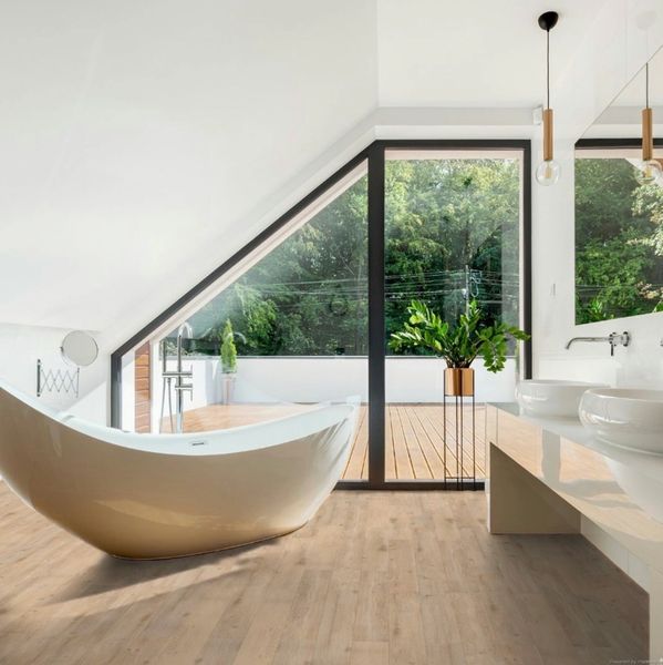 Modern bathroom with a freestanding bathtub and large window overlooking greenery.
