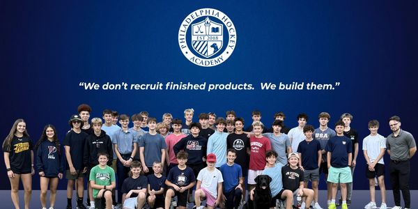 Group photo of young hockey players and coaches from Philadelphia Hockey Academy.