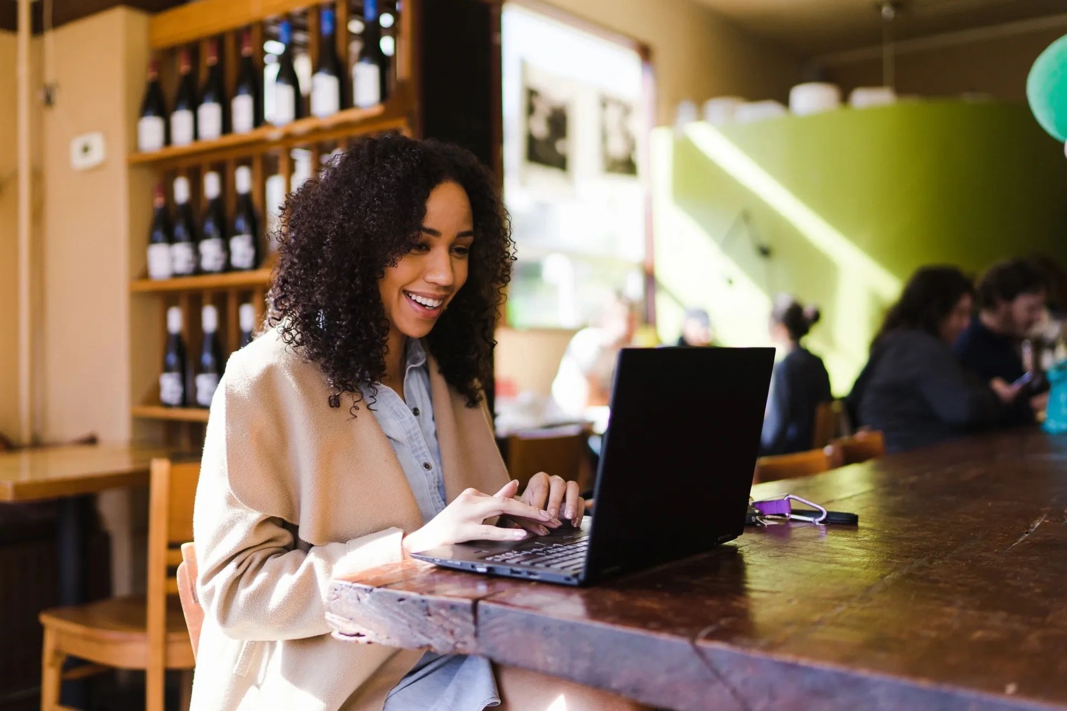 Lady viewing her laptop computer at a diner