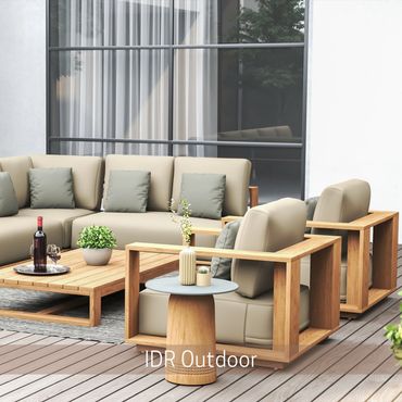 Outdoor seating area with a cushioned sofa and wood-framed armchairs on a deck.