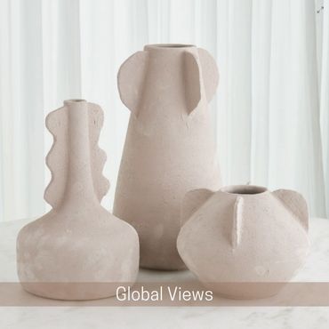 Three sculptural off-white ceramic vases of different shapes and sizes.