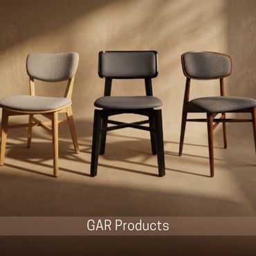 Three upholstered dining chairs in light gray, black, and dark brown against a tan backdrop.