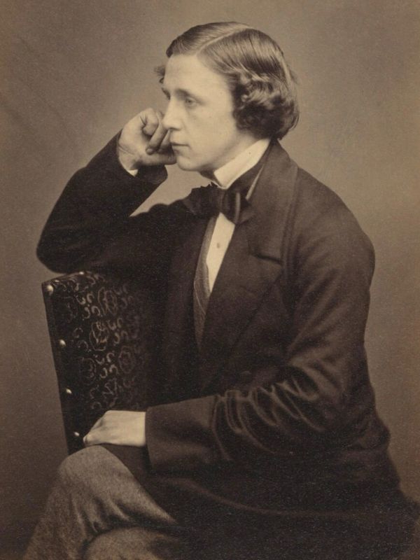 Vintage photo of a man seated, dressed formally.