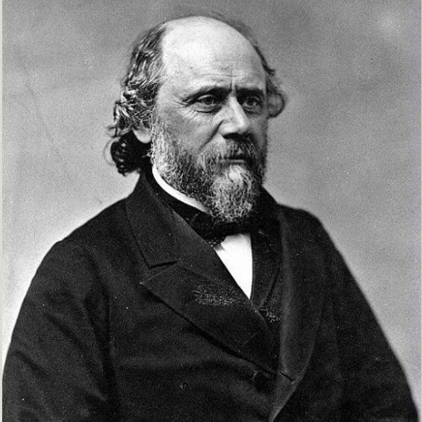 Black and white portrait of a bearded man in formal attire.