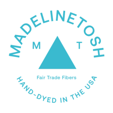Logo with a triangle and text "MADELINE TOSH".