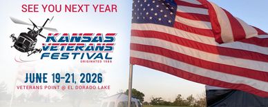 American flag waving at Kansas Veterans Festival announcement for June 2026.