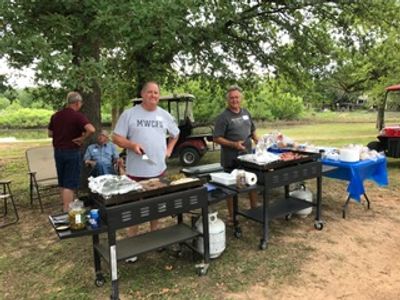 Cooking up Burgers and Hot Dogs for the Annual Meet 'n Greet