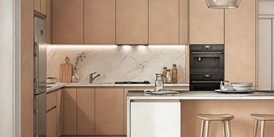 Modern kitchen with beige cabinetry and marble backsplash.