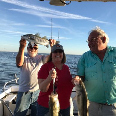 Jigging for stripers - Annapolis Sportfishing charters on board the Down Time