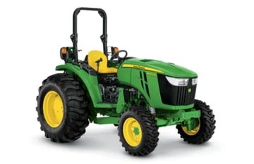 Green and yellow tractor with large tires.