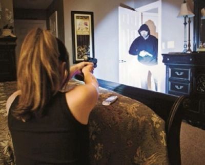 Woman aiming a gun at a masked intruder in her home.