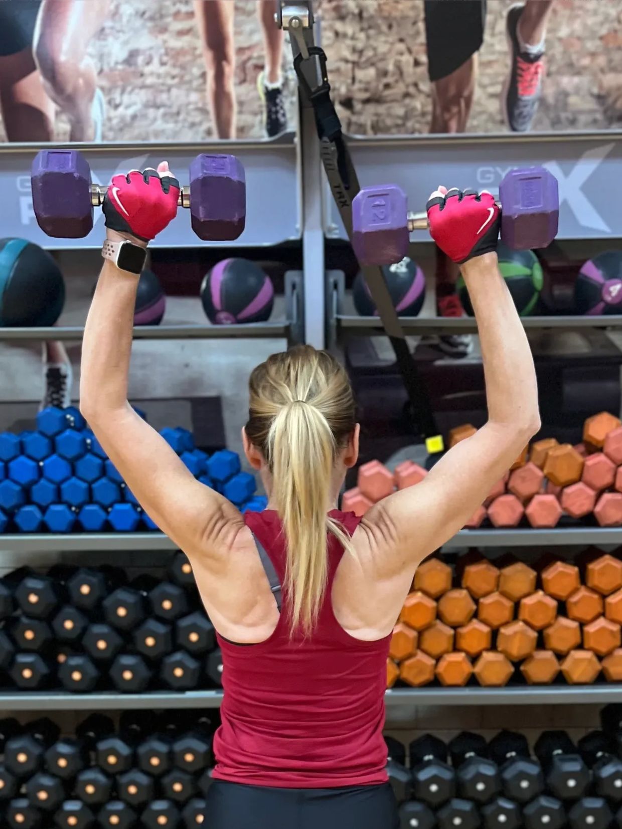 woman holding weights that is in good shape