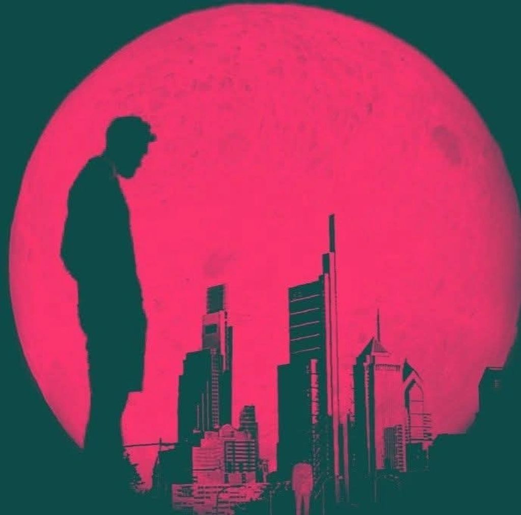 Silhouette of a man and city skyline against a large red moon.