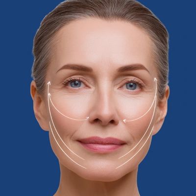 Mature woman with facial contour lines against blue background.