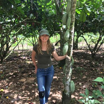 Jessica Ferraro in Miraflores, Ecuador, next to Nacional cacao tree