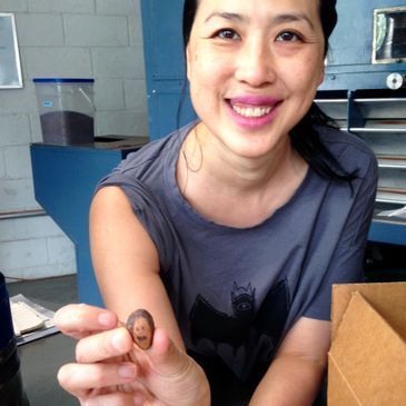 SOMA Chocolatemaker's Cynthia Leung in Toronto holding a happy cocoa bean