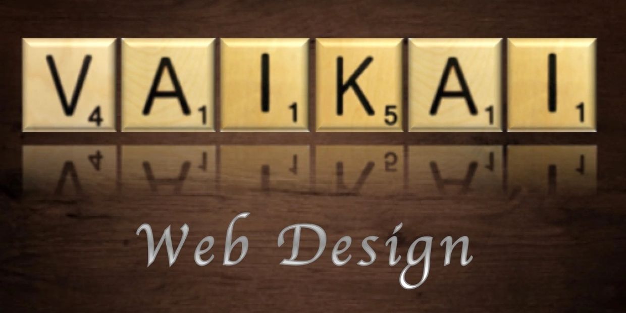 Vaikai web design logo. Wooden scrabble tiles showing a reflection on wooden table.