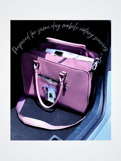 Purple handbag ready for mobile notary services with documents inside.