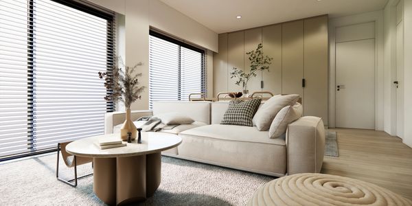 Spotlessly clean living room with a comfortable sofa, showcasing a well-maintained, inviting space.