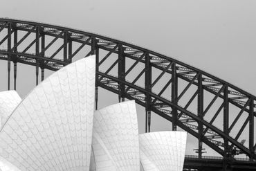 A monochrome fine art photograph showcasing the intricate architectural beauty of the Opera House.