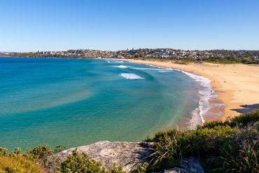 Landscape beach photography of Curl Curl, Sydney, Australia with turquoise clear blue water.