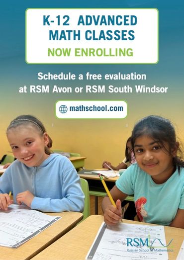 Two young girls in a math class with enrollment information.
