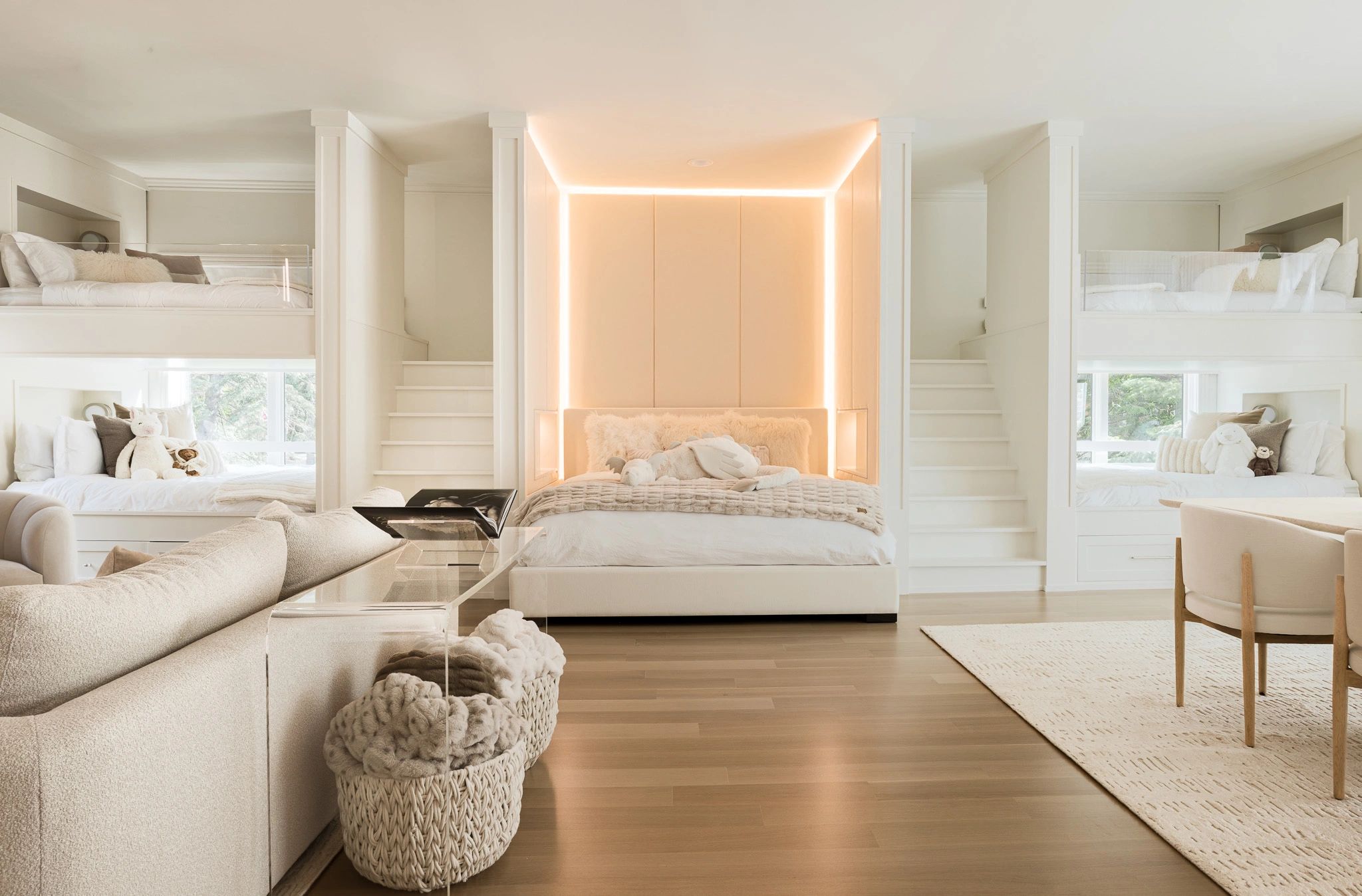 Bright modern bedroom with multiple beds and cozy decor.