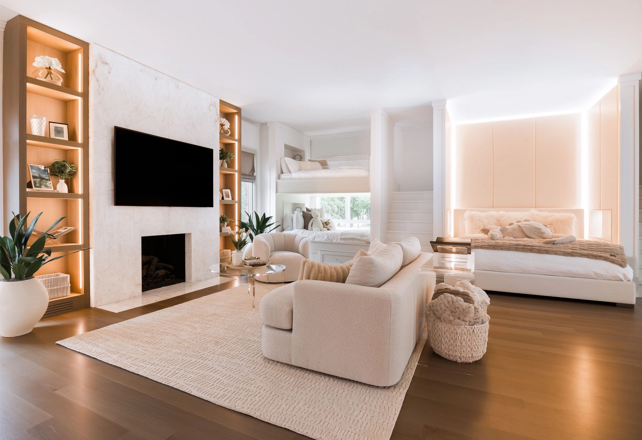 Bright and cozy living room with neutral tones and modern lighting.