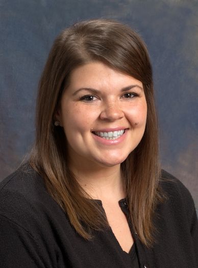 Picture of LaTaynia Conant, a woman in her late thirties with long brown hair. 