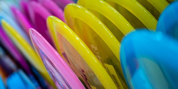 A rack of colorful discs sitting next to each other