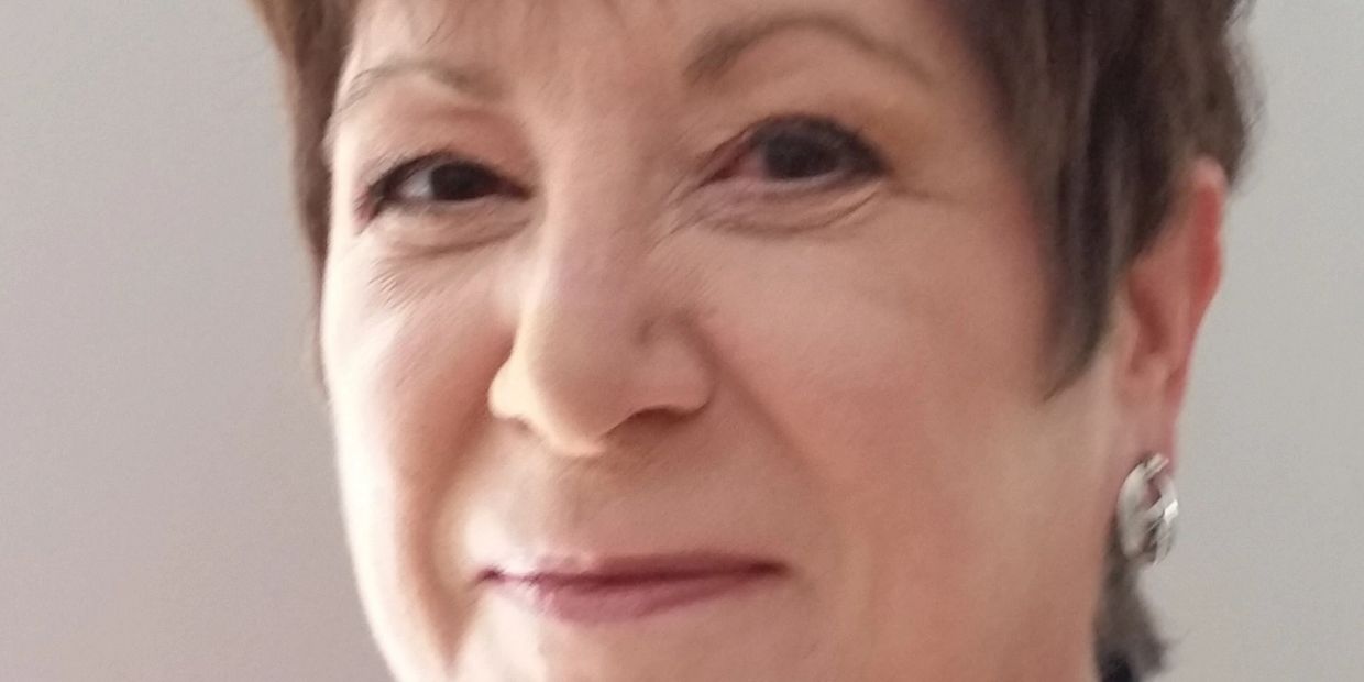 Close-up of a smiling middle-aged woman.
