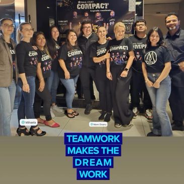 Group of people celebrating teamwork at a Compact event.