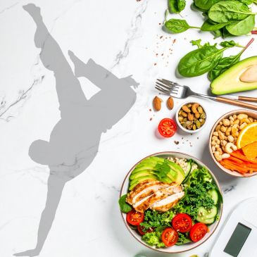 Shadow of a person doing a handstand beside healthy food and greens.