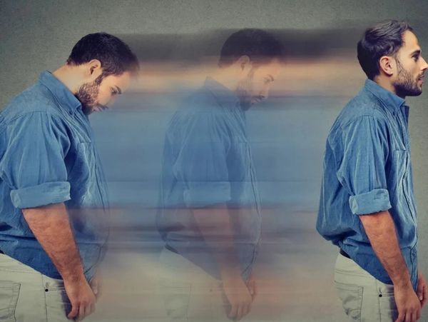 A man transitioning from sadness to confidence, visualized with a motion blur effect.