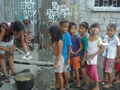  Children line up at one of our newest Bread of Life Feeding Centers in Manila  