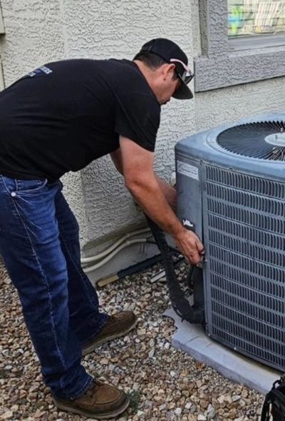 Licensed HVAC technician performing AC repair in Phoenix Arizona