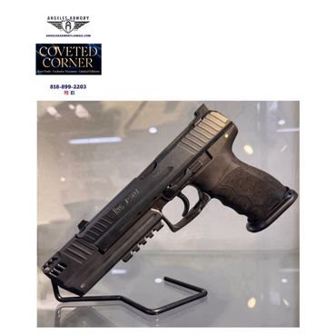 Black semi-automatic handgun displayed on stand.