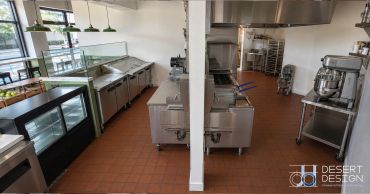 Clean professional kitchen with stainless steel appliances.