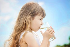 young girl drinking pure water from The Water Solution products