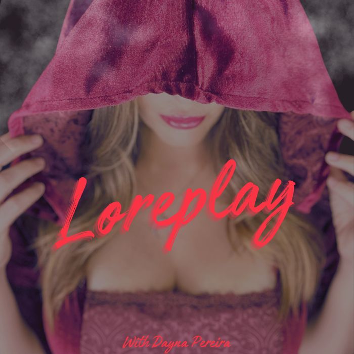 Woman in a red velvet hooded dress covering her face like a witch and red lipstick. Loreplay