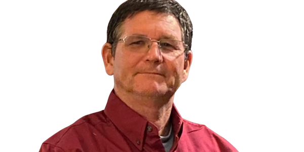 Man in a red shirt with embroidery.
