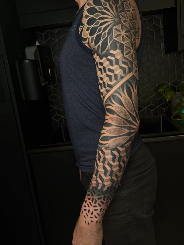 Bold Geometric & mandala sleeve tattoo — by Vancouver + Seattle tattoo artist Crystal Alexandria.