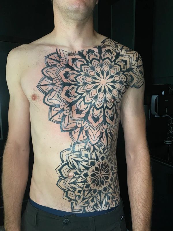 a full torso, detailed tattoo of two giant Mandalas with clean detailed line work
