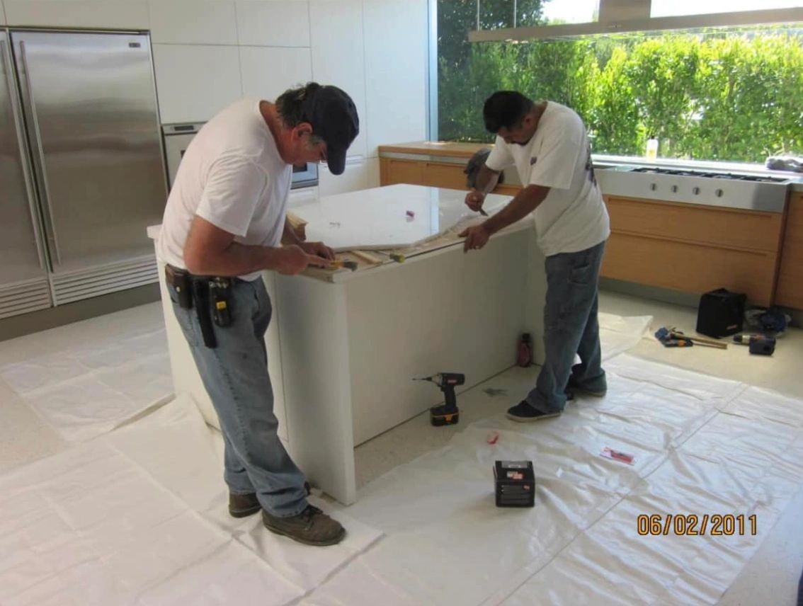 See the careful hammering on a kitchen's white marble.