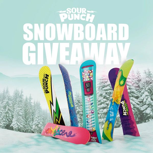 Sour Punch snowboard giveaway with colorful boards in snowy landscape.