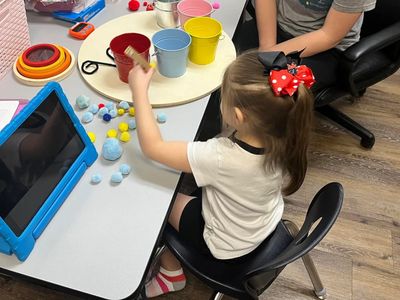 child working on fine motor skills during ABA therapy
