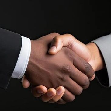 Two people shaking hands in a formal setting.