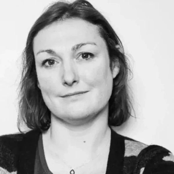 Black and white portrait of a woman with a slight smile.