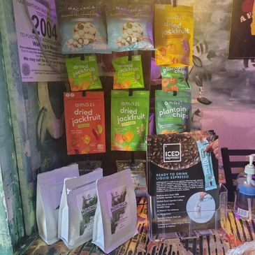 Various packaged snacks and coffee products displayed on a counter.